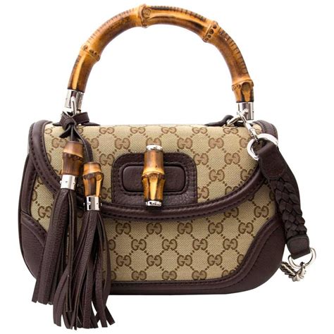 gucci monogram with bamboo handles|gucci handbags prints.